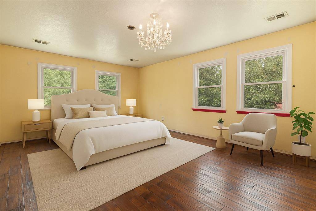 Primary bedroom offers dual closets and a private en suite. (Virtually Staged)