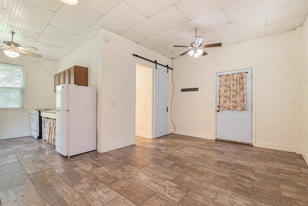 First floor mother-in-law suite showcases a kitchen, bathroom, and ample privacy.