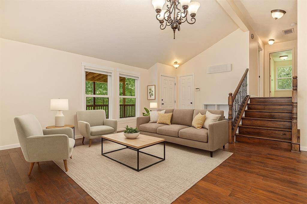 Charming living room with high ceilings! (Virtually Staged)