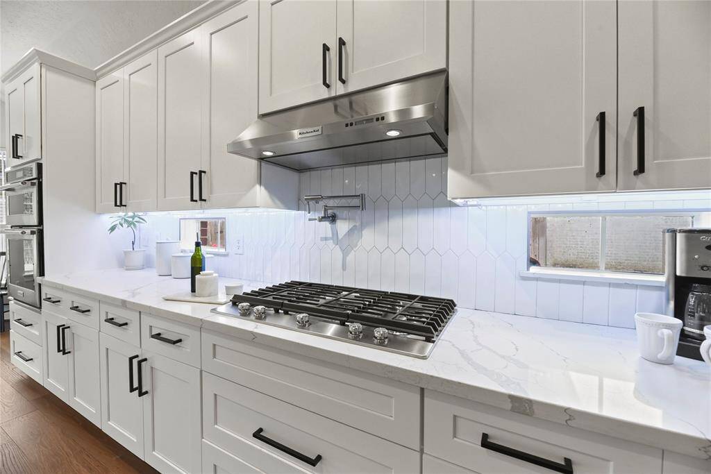 Kitchen Aid appliances-Convection microwave and oven, cooktop and vent hood.