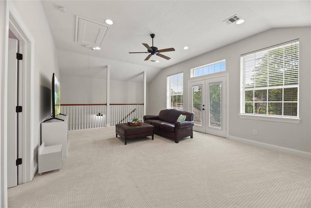 And a balcony overlooking the parklike backyard!