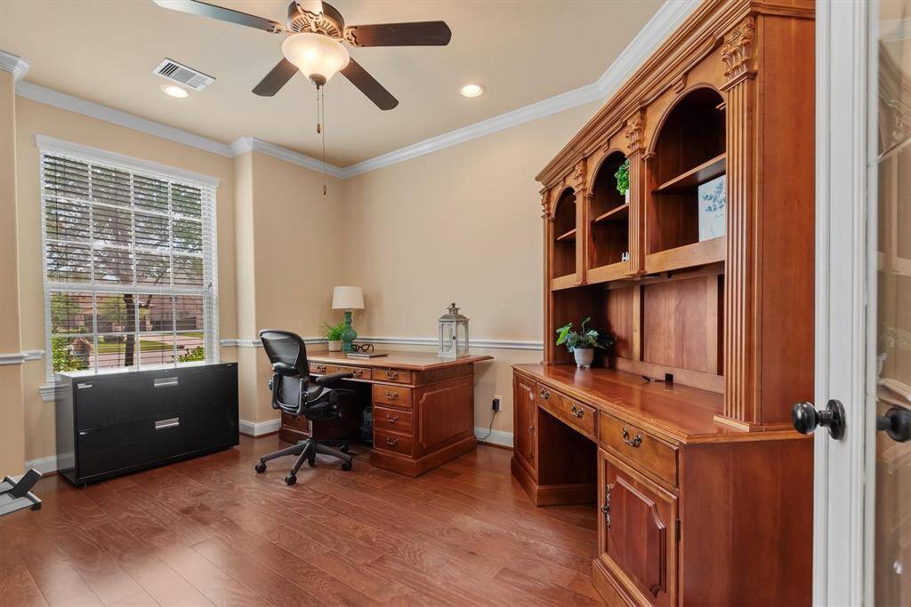 Located at the front of the home, this dedicated office space offers the perfect blend of privacy and productivity.  Natural light pours in the windows creating an inspiring workspace.
