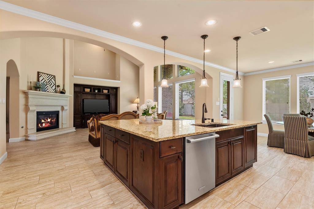 At the heart of the kitchen sits a large, statement-making island—perfect for gathering, prepping, and entertaining. With ample seating, generous counter space, and stylish finishes, this island is both functional and inviting.
