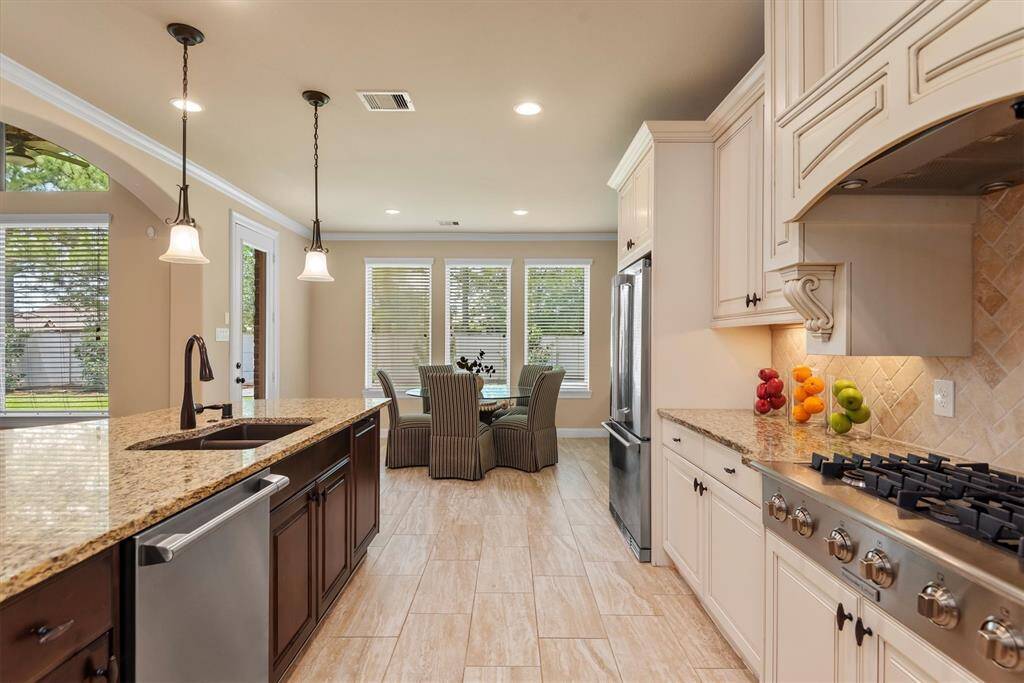 The kitchen opens right into the functional breakfast room with lovely views of the backyard.