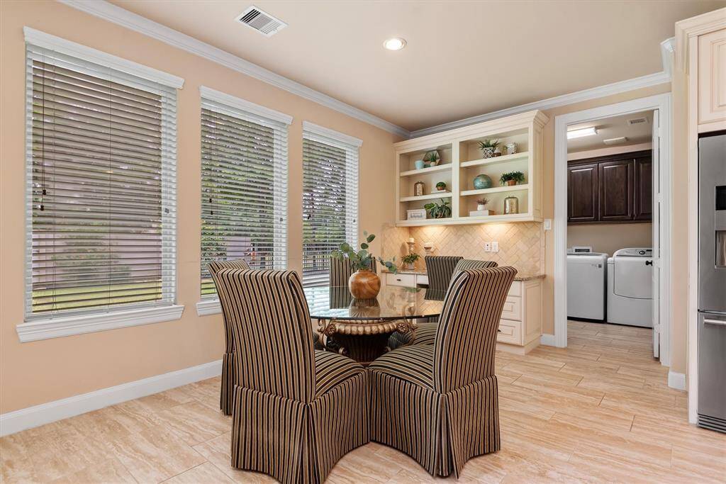 More than just a place to start your day, this breakfast room offers added versatility with its own built-in shelves and dedicated counter space perfect for a coffee bar.