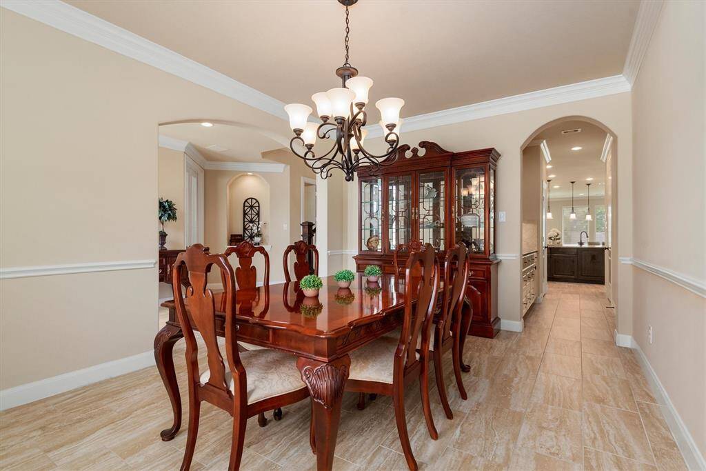 This spacious and elegant dining room offers the perfect setting for both formal dinners and festive celebrations. With ample room for a large table, statement lighting, and refined architectural details, it’s a space designed to impress.