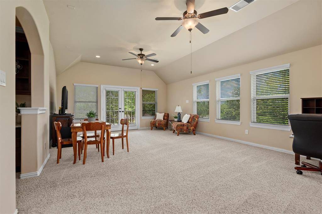 This versatile game room offers the perfect place to relax, entertain, or unwind—complete with direct access to a large balcony. Whether you're hosting game nights, setting up a media space, or enjoying the breeze and views outside, this upstairs retreat combines indoor fun with outdoor living in one seamless space.