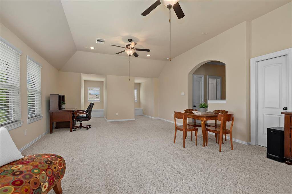 Tucked into the upstairs game room are charming wall niches that create the perfect spot to sit, relax, and take in the view.