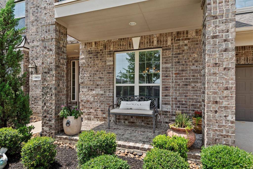 The welcoming front porch, perfect for morning coffee or evening chats, set the tone for the warmth inside.