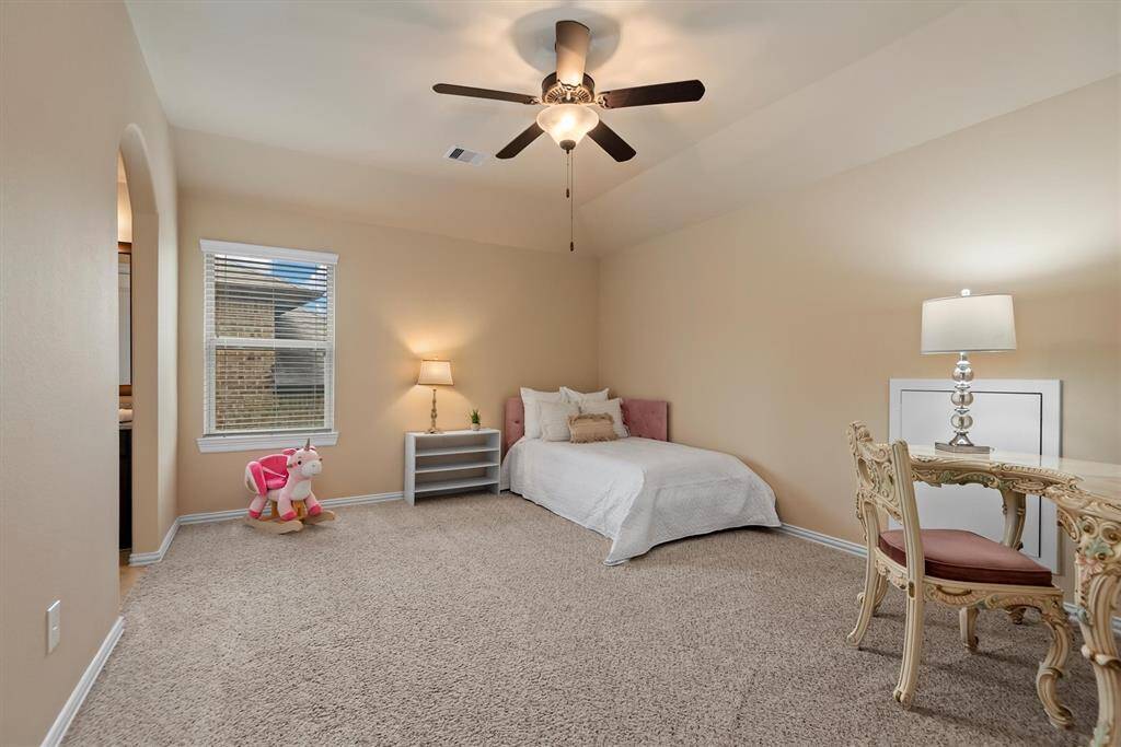 This large secondary bedroom offers plenty of space and another walk-in closet.