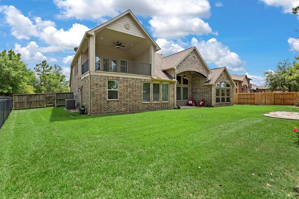 Looking up from the backyard, the upstairs balcony makes a stunning statement—adding both beauty and dimension to the home’s exterior. With its elegant design and elevated presence, it enhances curb appeal while offering a graceful connection between indoor and outdoor living.