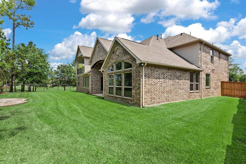 There's ample greenspace on both sides of the home.