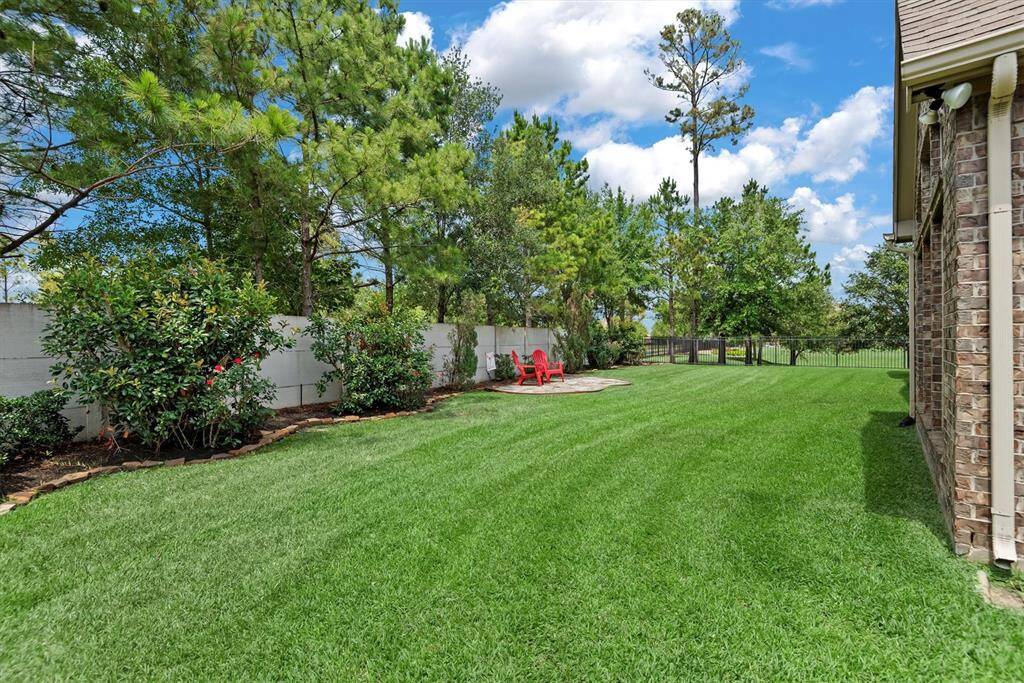 Enjoy the beauty and privacy of a fully landscaped yard with mature trees and thoughtfully placed greenery. The established landscaping creates a serene outdoor setting, offering shade, curb appeal, and a welcoming environment from the moment you arrive—no waiting for trees to grow or gardens to fill in.