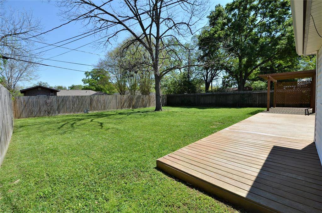 In addition to the backyard enjoy the built wooden deck for family or friends gatherings.