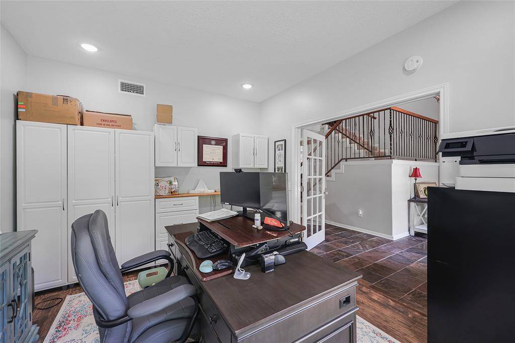 The alternate perspective shows even more cabinetry and functional workspace.