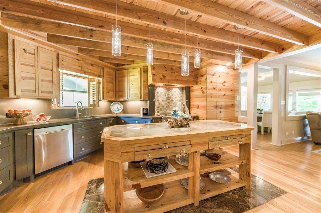 Featuring stainless appliances with a large hammered stainless steel sink with push-button garbage disposal