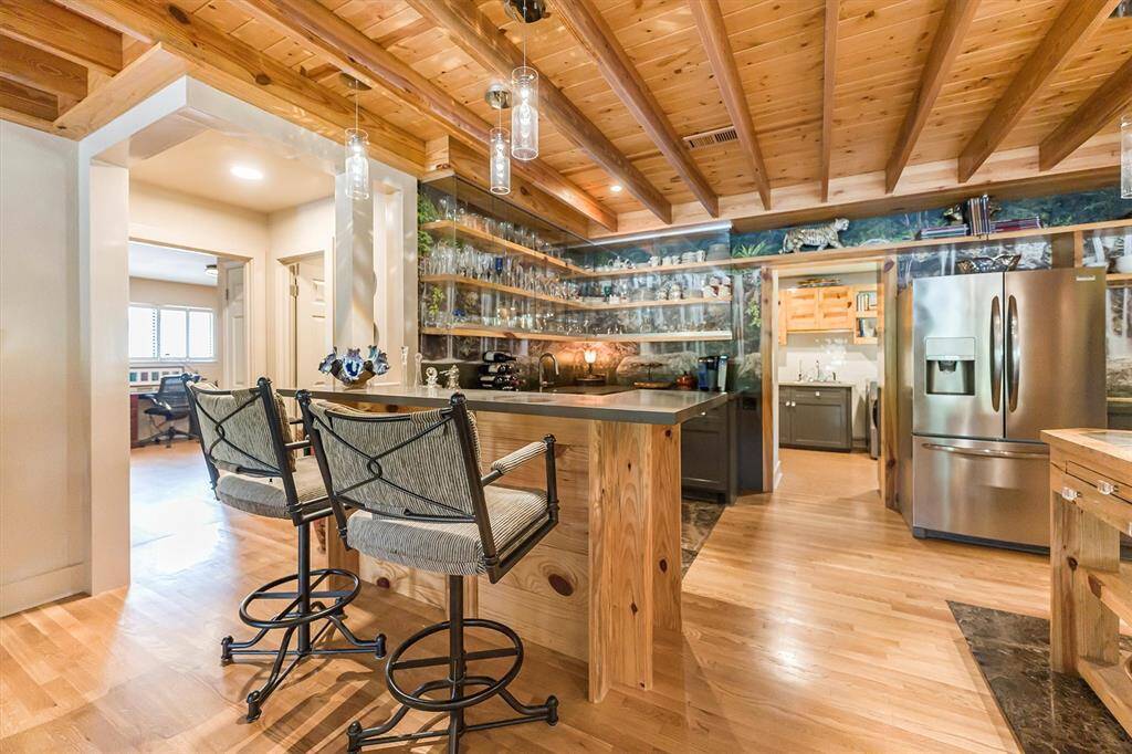 Kitchen cabinetry includes drawers, two spice racks, sheet pan cabinets, and access door pantry; quartz countertops