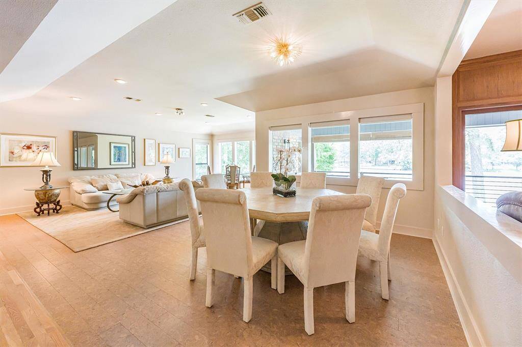 Dining area with built-in china storage and lake views