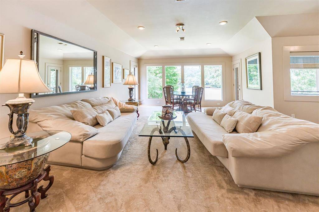 Spacious living, designer touches, and breathtaking views of Azalea Lake — perfect for entertaining, relaxing, and creating memories
