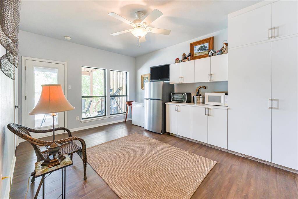 Additional bedroom with full bath and private patio/pool access, built-in cabinets, and direct pool-to-bathroom entry