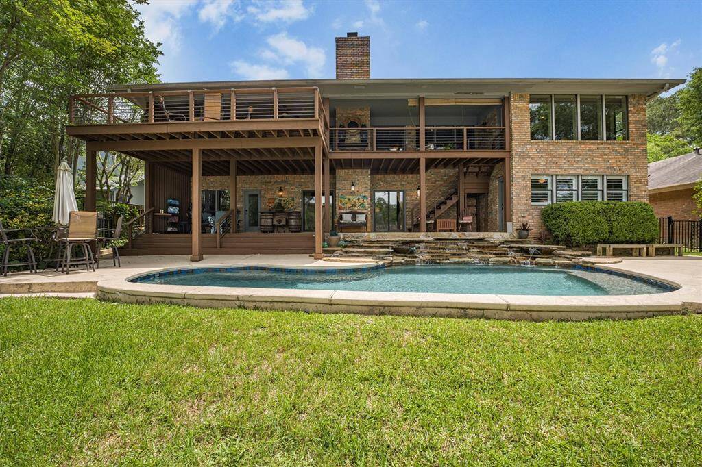 Large, partially covered upper and lower decks with stair access to pool