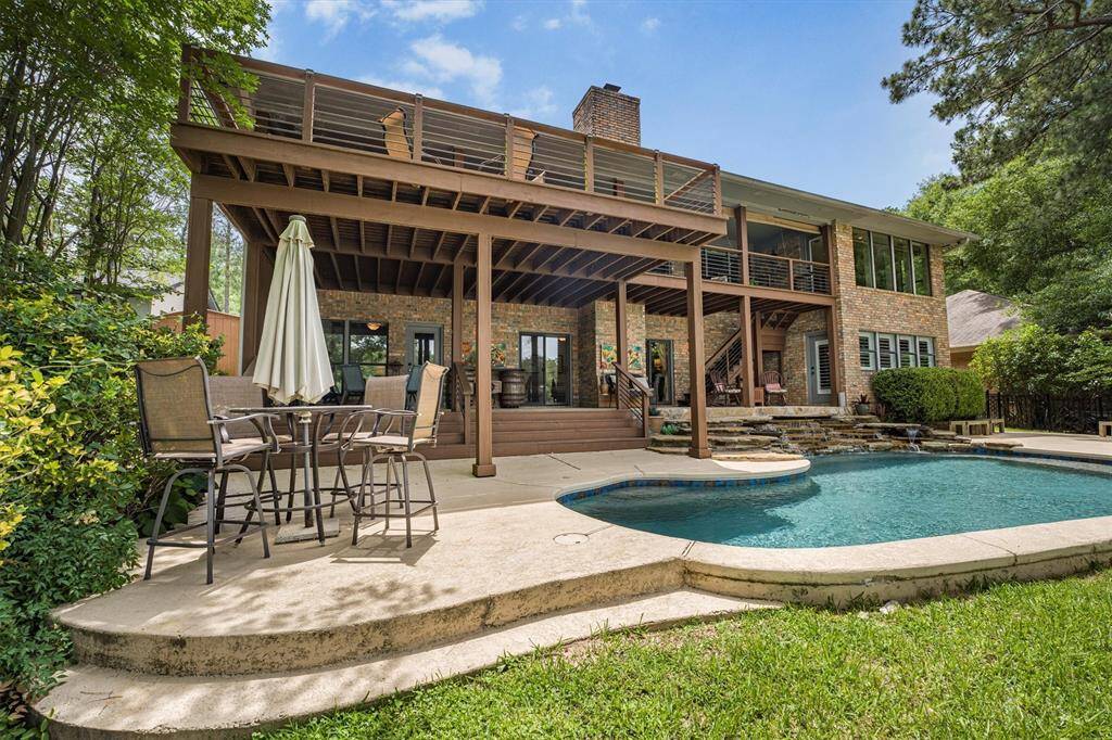 Beautiful pool with ramp entry, 8 spa jets, in-pool bench, and large waterfall