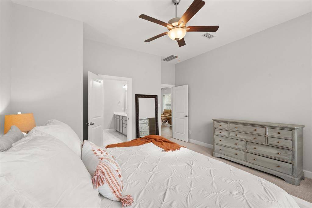Off the office space in the back of the home is the Primary bedroom.