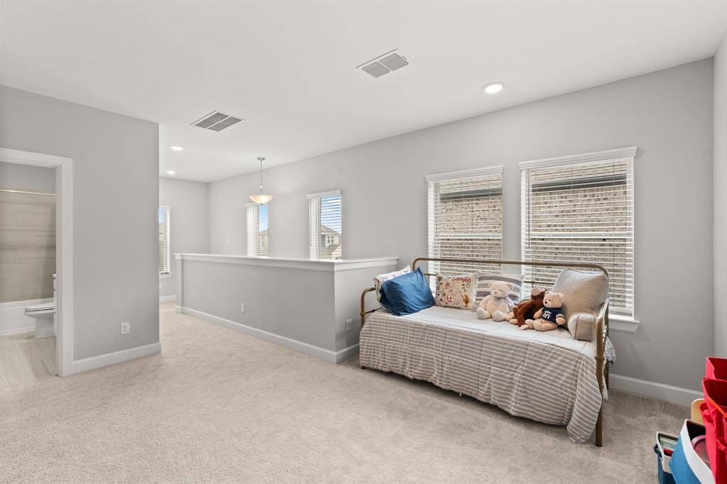 At the top of the stairs is a large game room or second living area.
