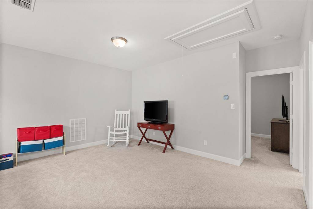 Just off the game room are two secondary bedrooms.