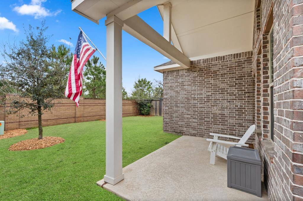 Beautiful view of the backyard and covered porch.