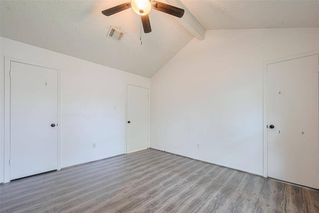 Primary Bedroom, left door open to walk in closet