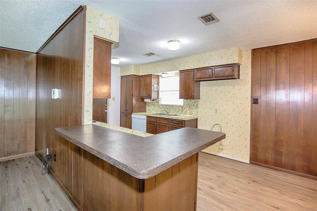 The breakfast bar offers a casual and convenient spot for quick meals or morning coffee, with seating that overlooks the kitchen.
