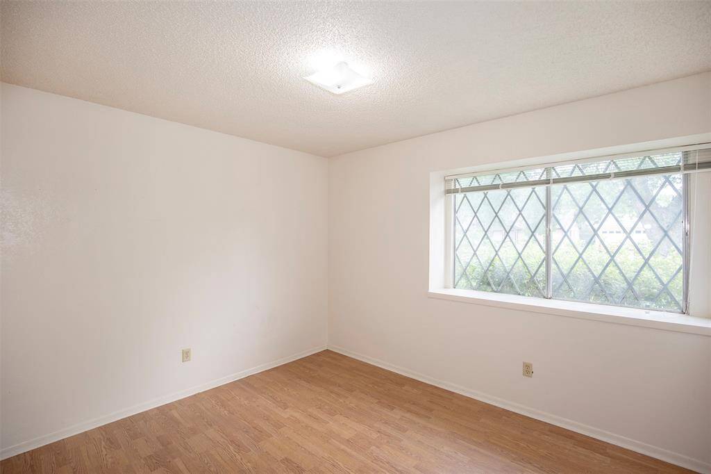 The wide ledge beneath the window offers the perfect spot to display decor, curl up with a book, or simply enjoy the view.