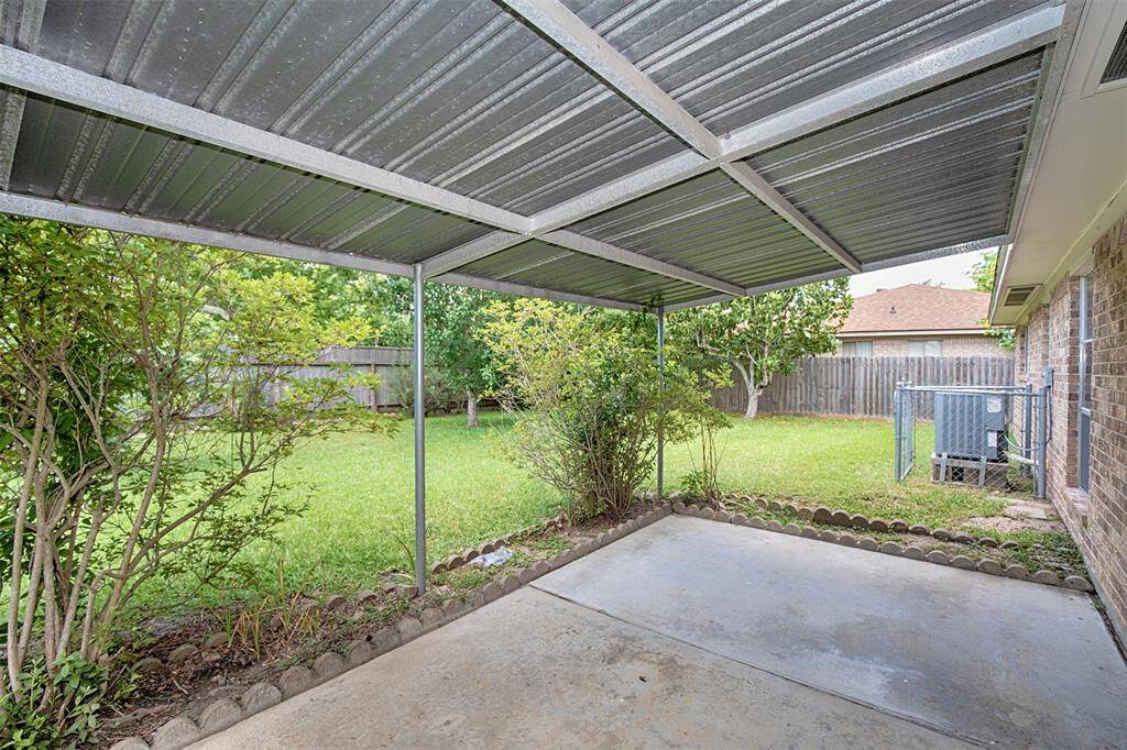The covered patio is a great place to enjoy a cold beverage after a long day.