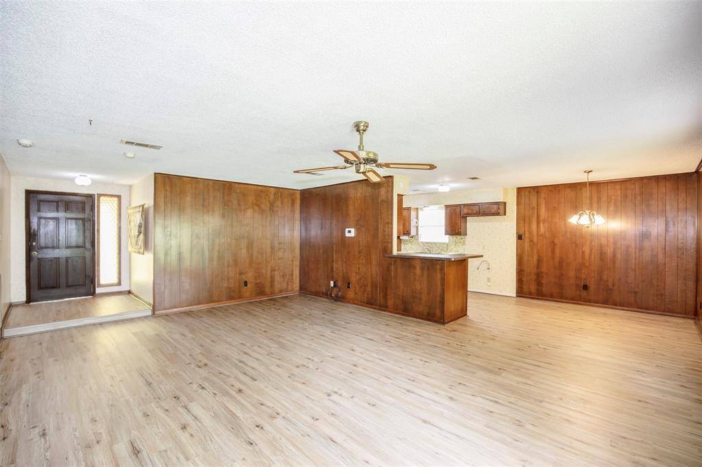 Designed for both relaxing and entertaining, the family room seamlessly flows into the dining area and kitchen, creating a connected and inviting atmosphere for gatherings of any size.