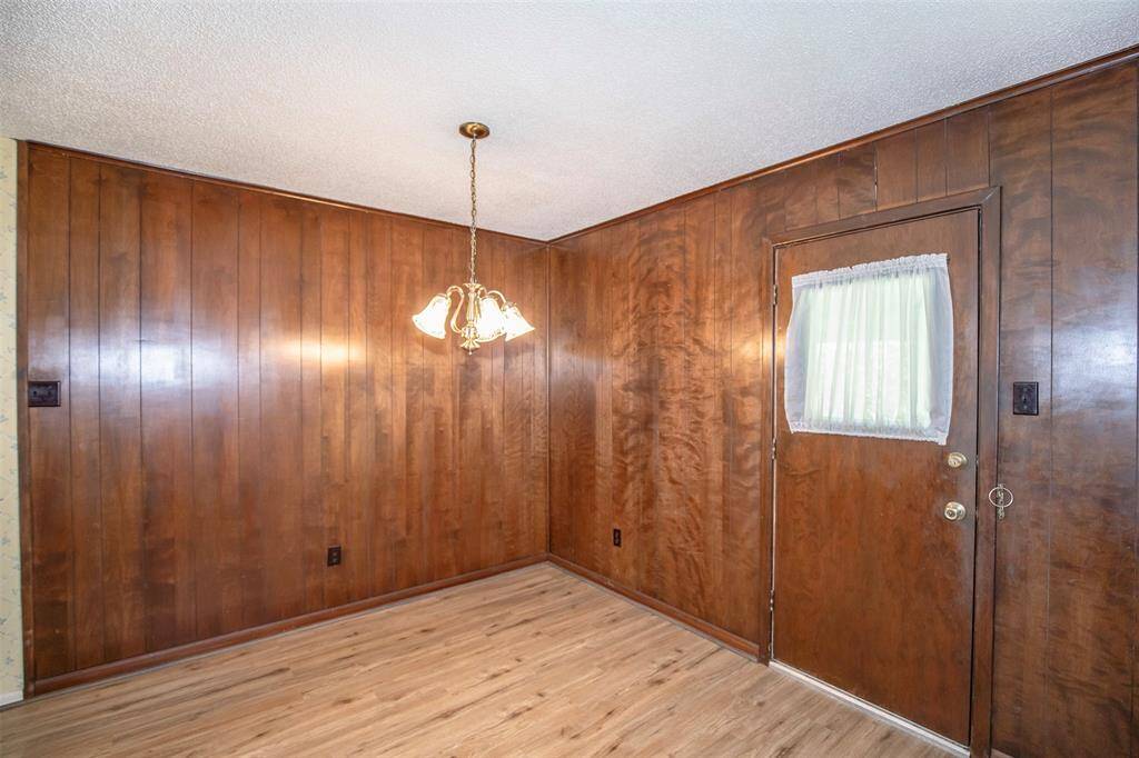 The dining area is located near the back door.