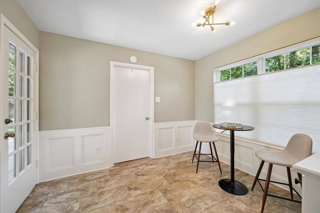Cozy breakfast area with ample natural light and fresh feel.