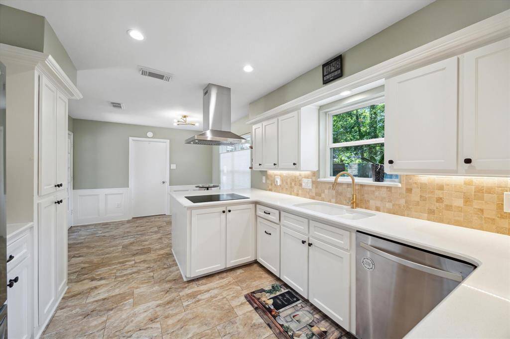 Inviting kitchen with plenty of workspace and storage.