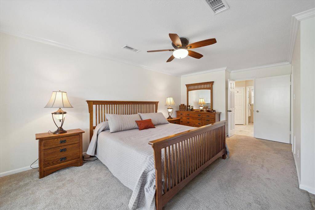 Sunlit primary suite with ensuite bath for added privacy.