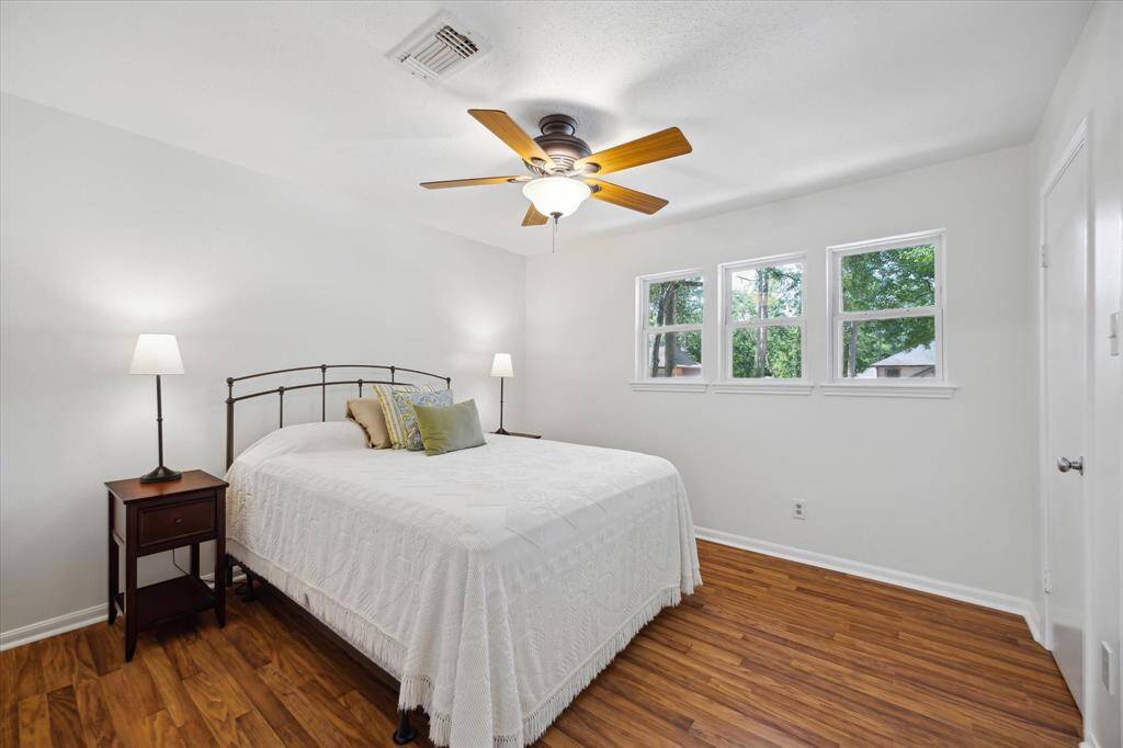 Comfortable, light-filled bedroom with a tidy layout.