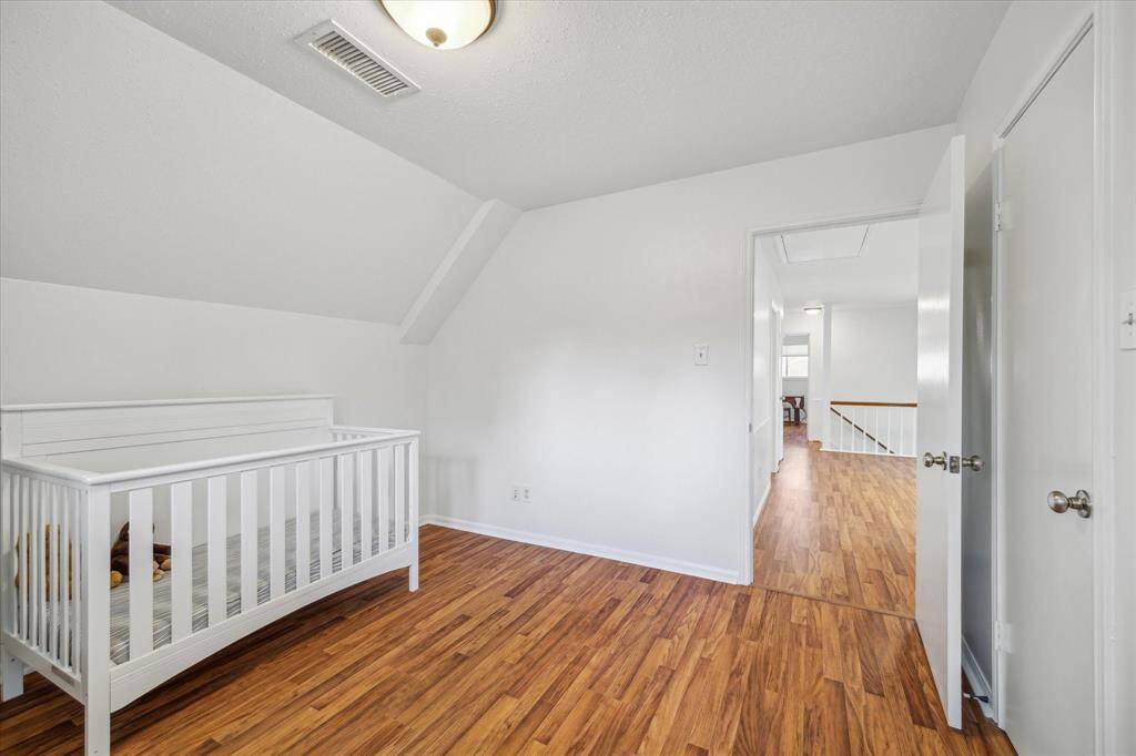 Light-filled child’s room with a simple, clean layout.