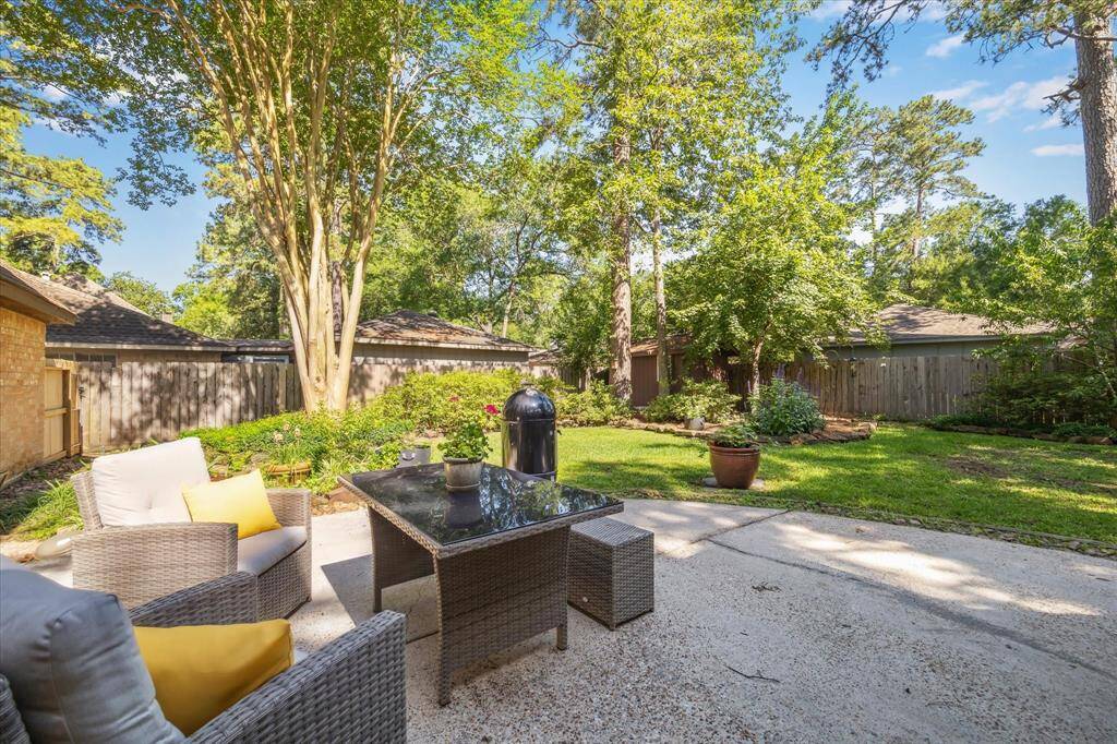 Backyard with open patio, perfect for relaxing or entertaining.