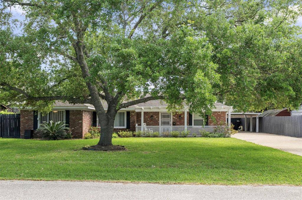 Front elevation shows the extended front patio only steps from the lake