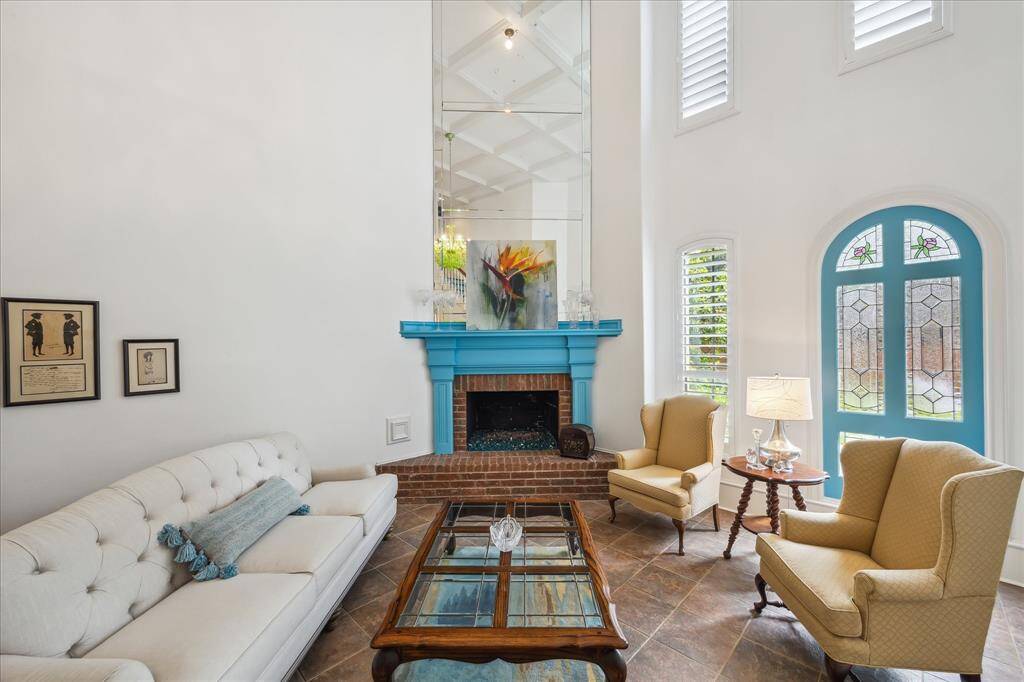 The family room has a fireplace as the focal point with a stately mirror that goes all the way to the ceiling!