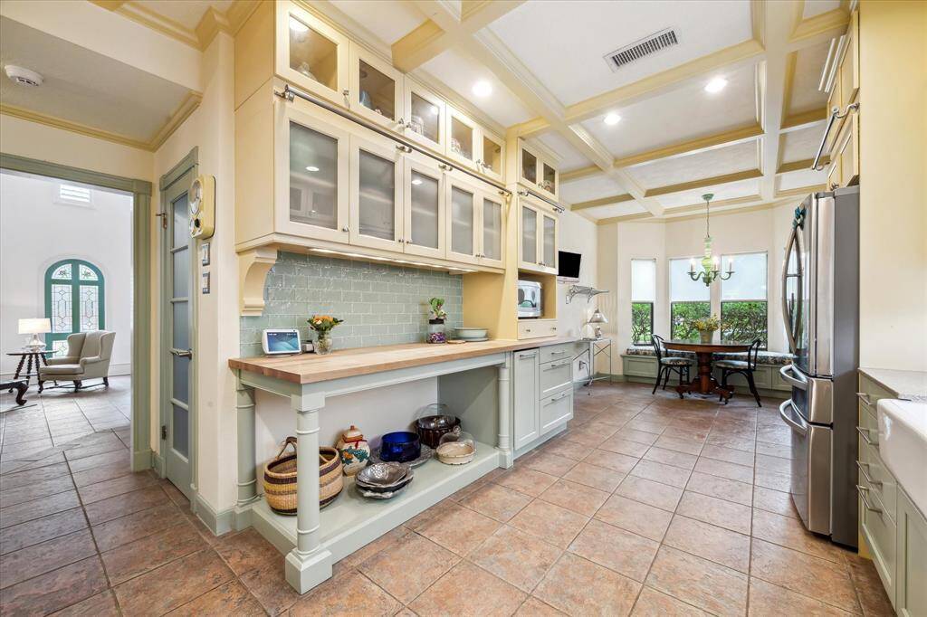 The gorgeous kitchen space looking into the breakfast room. The walk-in pantry is on the left.