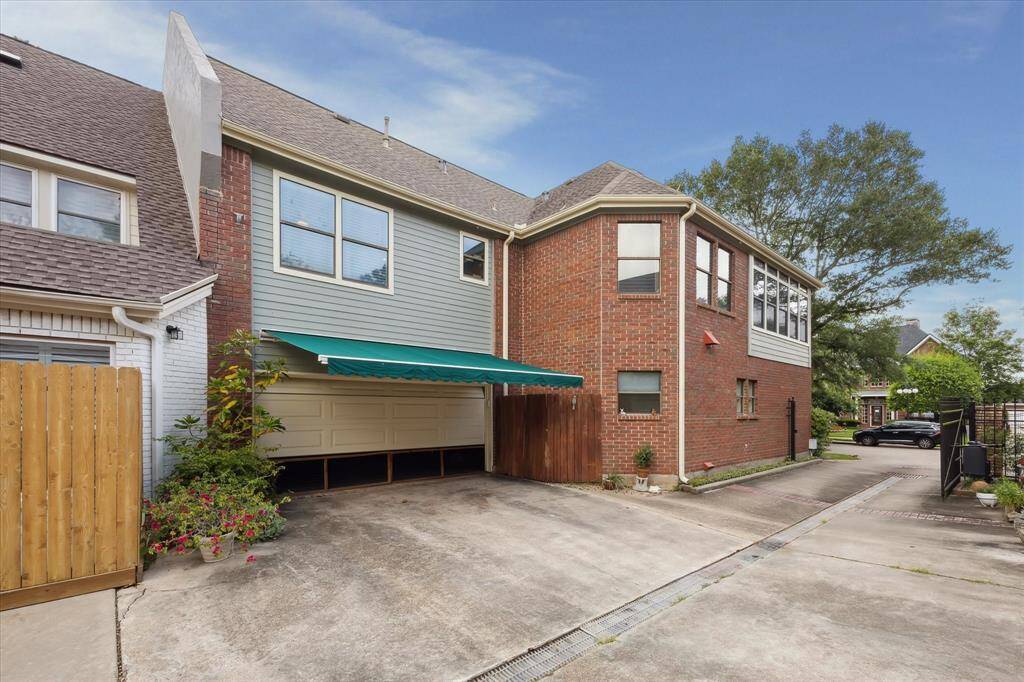 The attached garage has an awning to create an entertaining space outdoors.