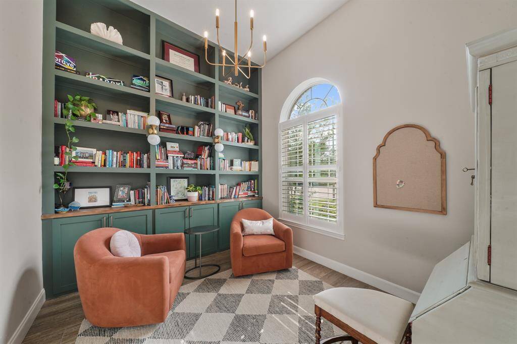 This Office is also off the Entry way and is playful yet sophisticated with its colored built-in bookcases