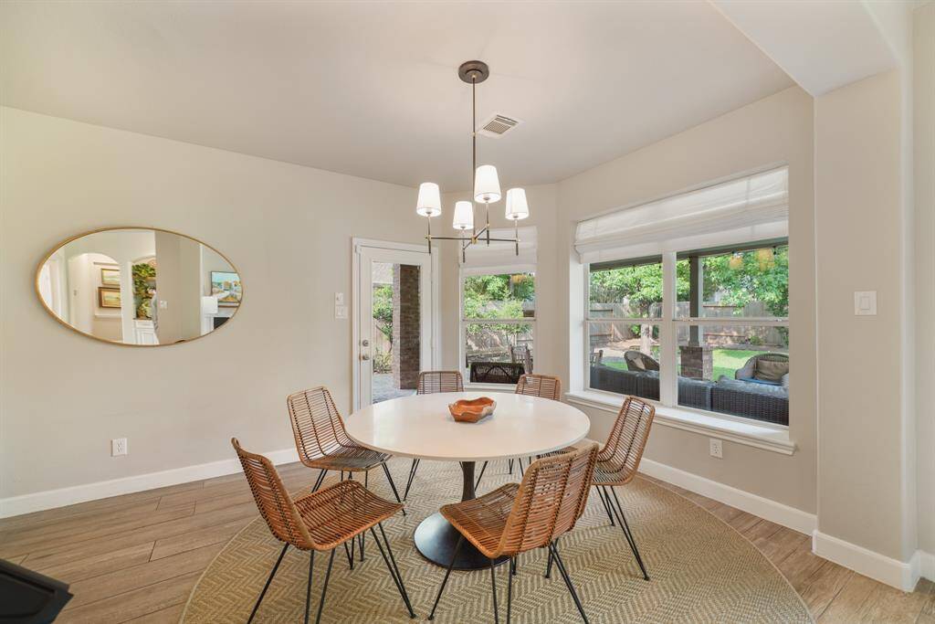 This Breakfast Room is connected to the Kitchen and provides access to the covered back Patio