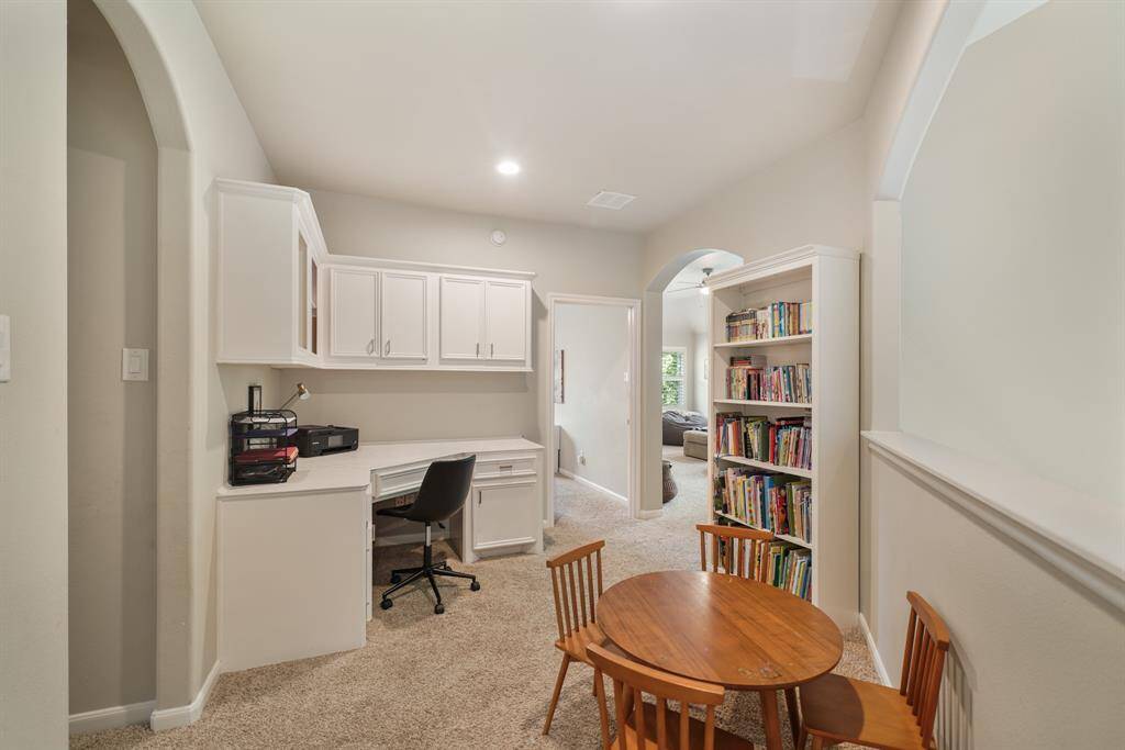 Upstairs, carpeted built-in homework/office space