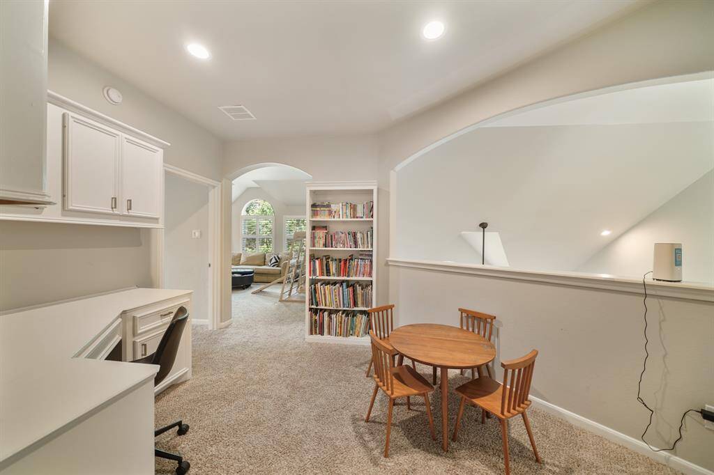 The upstairs homework space looks over the first floor and is a pass-thru to the Gameroom